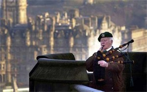Bill Millin plays his pipes at the Edinburgh Military Tattoo in 2001. The 2010 edition of the Pipes of Christmas will perform a special tribute in memory of this heroic piper