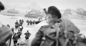 Piper Bill Millin heads onto Sword Beach during the D-Day invasion